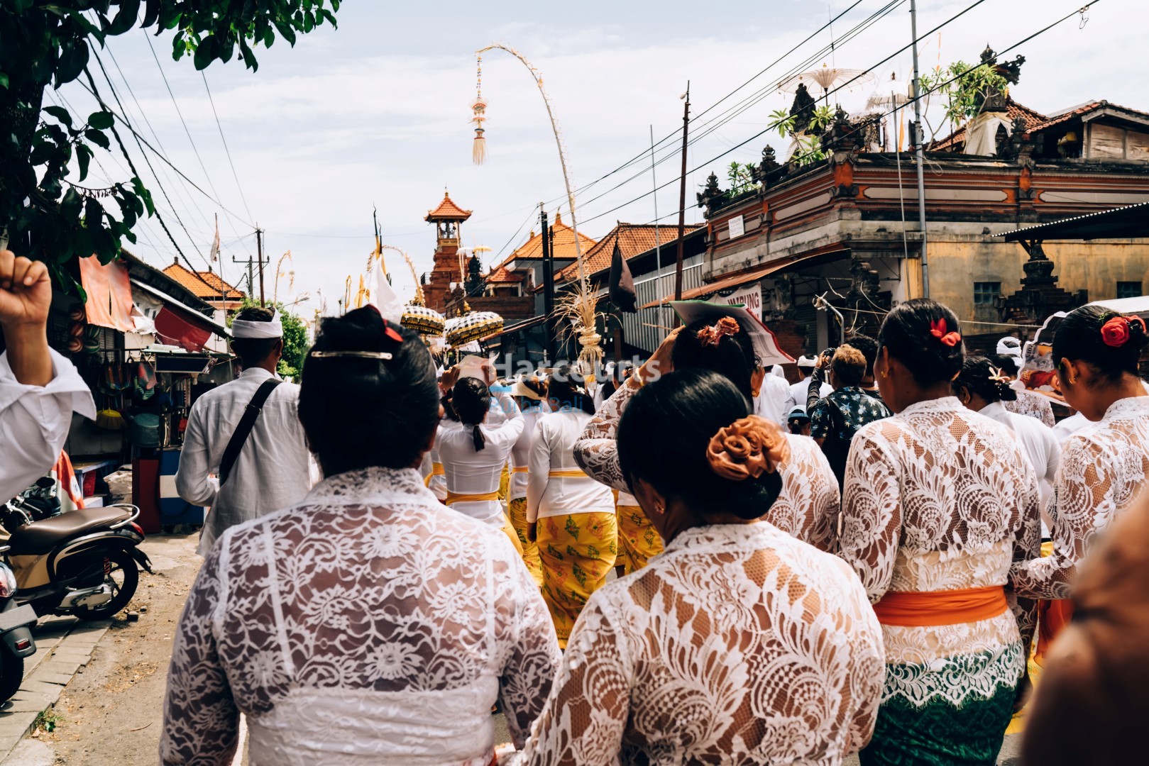 Hindu people on street near religious building