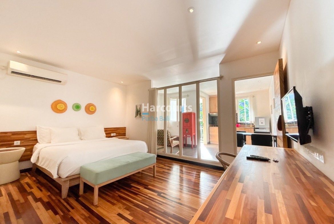 Jimbaran Apartment Complex Wooden Cabinetry Mosaic Tile Backsplash