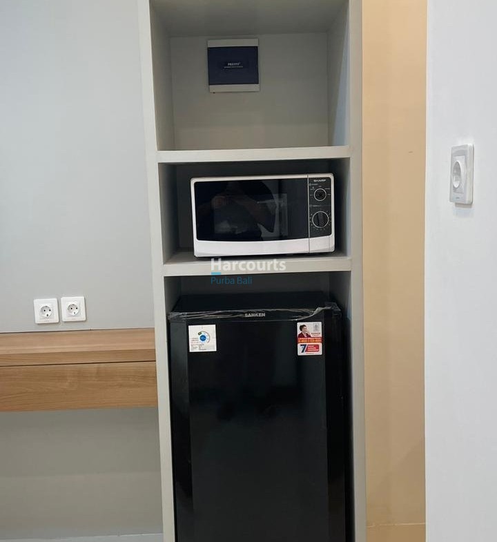 Kuta Leasehold Apartment White Shelving Microwave Fridge