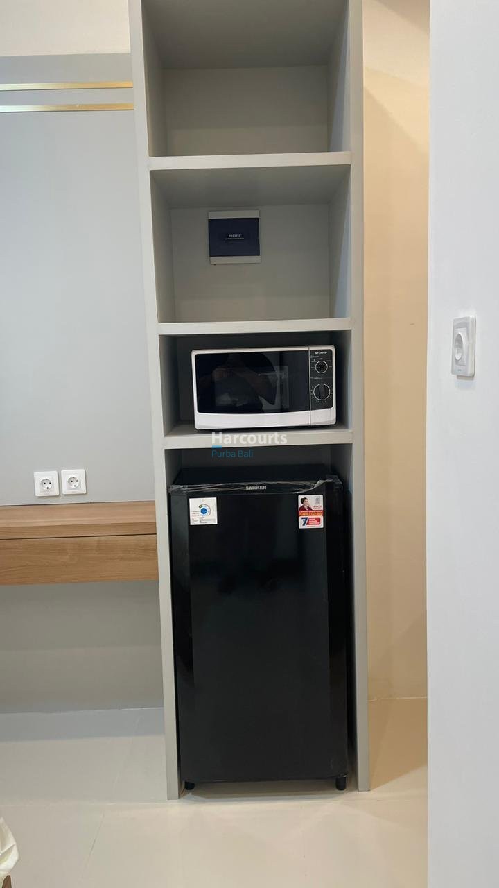 Kuta Leasehold Apartment White Shelving Microwave Fridge