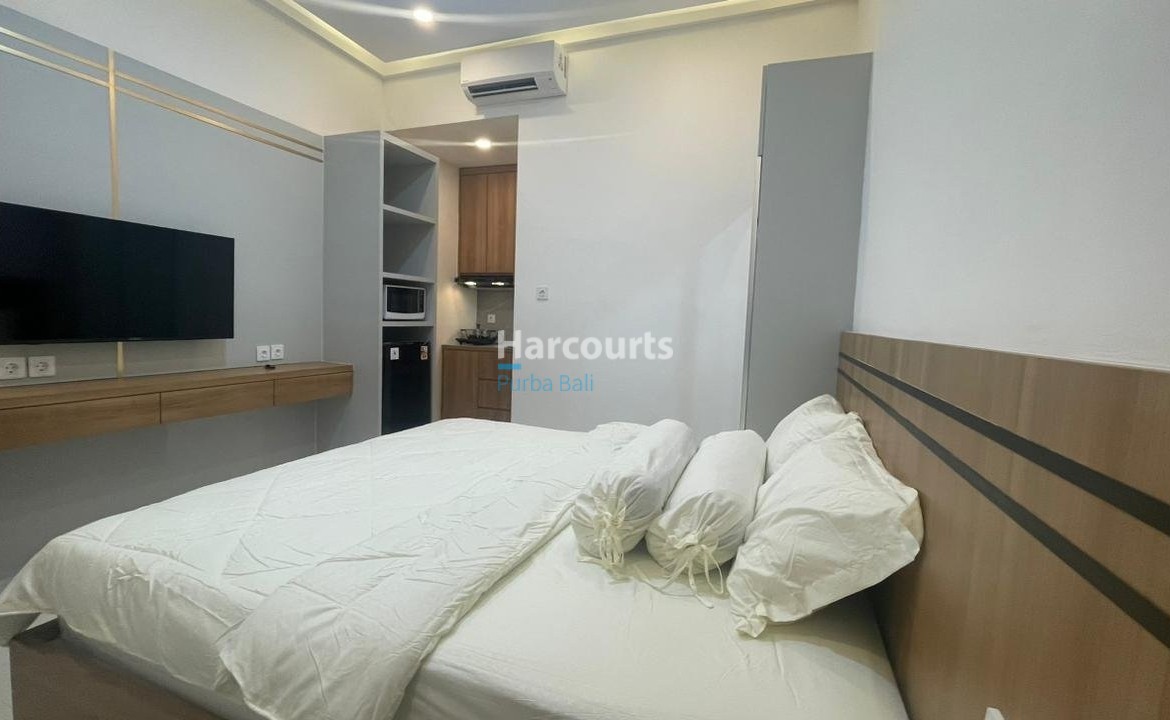 Kuta Leasehold Apartment Wooden Headboard White Bedding