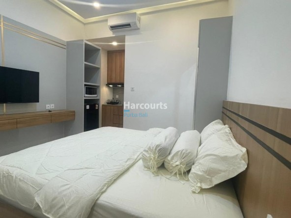 Kuta Leasehold Apartment Wooden Headboard White Bedding