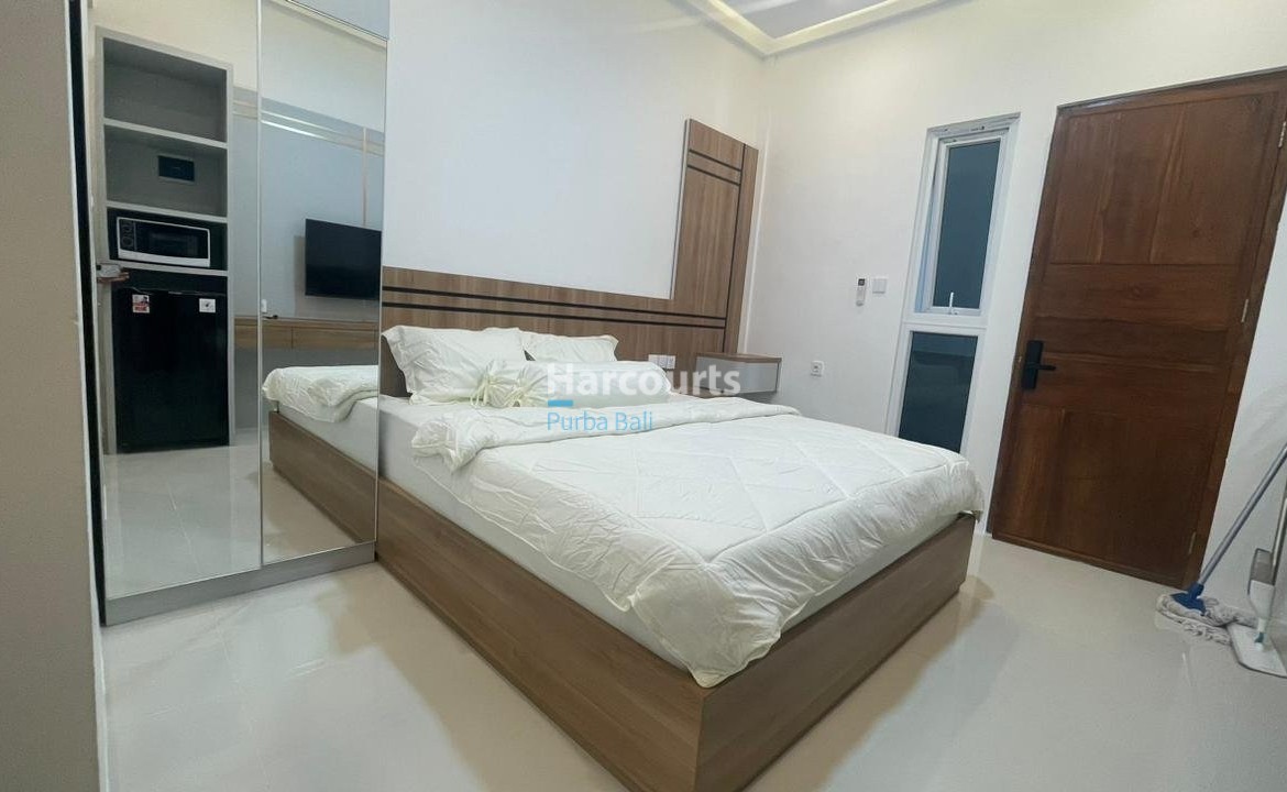 Turnkey Kuta Apartment White Floors Wooden Headboard